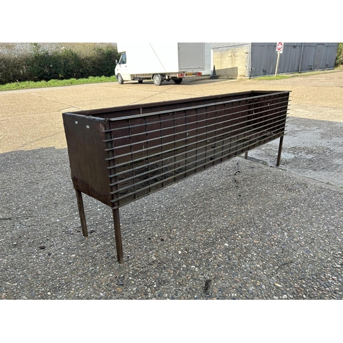 150 - A vintage ironwork trough planter 207cm long 77cm tall