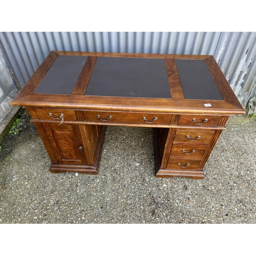 159 - A modern reproduction twin pedestal desk with three section leather top  138x77x80