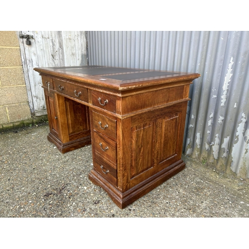 159 - A modern reproduction twin pedestal desk with three section leather top  138x77x80