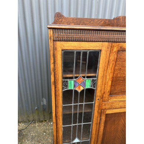 168 - A early 20th oak bureau cabinet with fall front and leaded glass doors 152x36x130