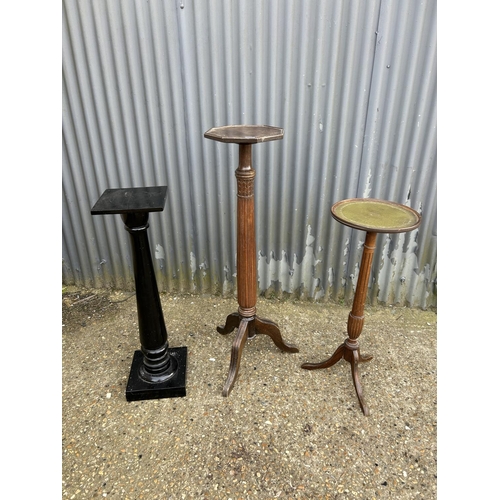 187 - Two mahogany plant stands and a black painted plant stand