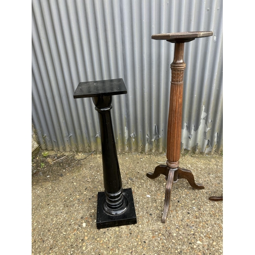 187 - Two mahogany plant stands and a black painted plant stand