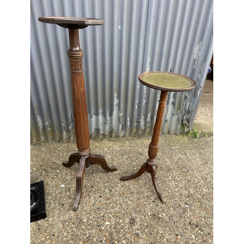 187 - Two mahogany plant stands and a black painted plant stand