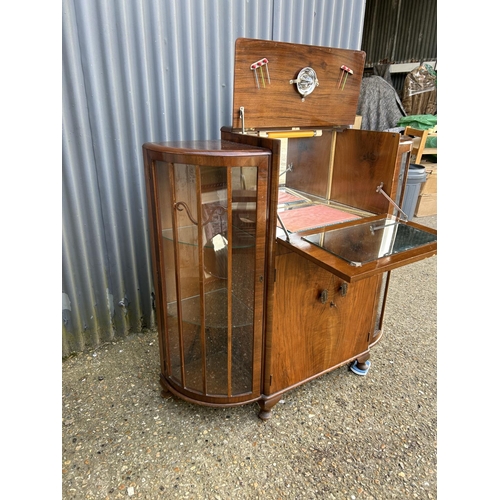 201 - A 1920's walnut cocktail drinks / display cabinet