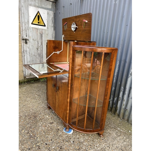 201 - A 1920's walnut cocktail drinks / display cabinet