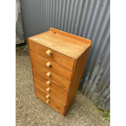 212 - A country pine chest of seven drawers 60 x40x108