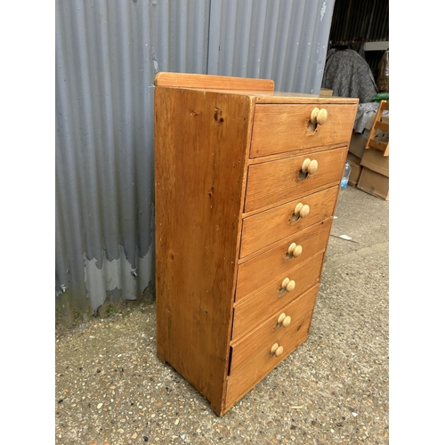 212 - A country pine chest of seven drawers 60 x40x108