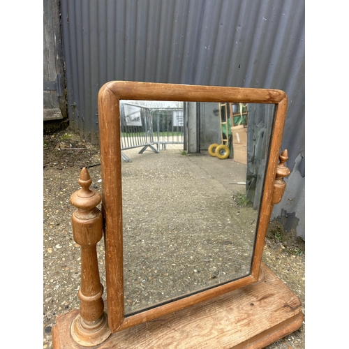 215 - A Victorian pine swing mirror