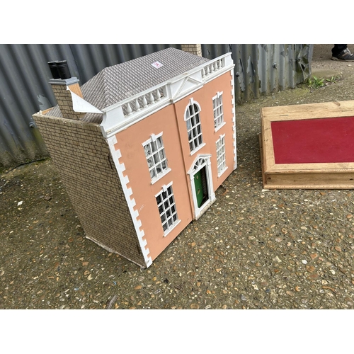 34 - A vintage dolls house together with a pine writing slope