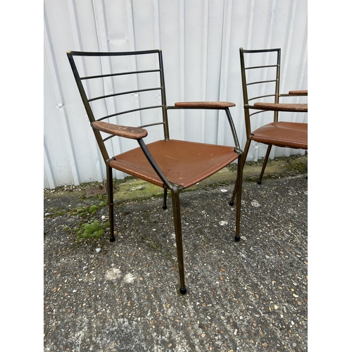 4 - A set of four mid century Italian  style metal carver chairs with leather seats