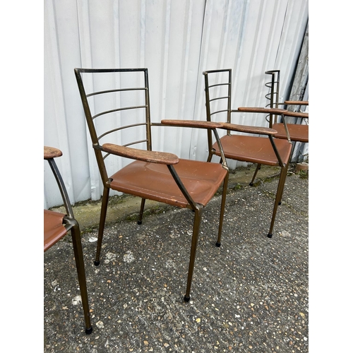 4 - A set of four mid century Italian  style metal carver chairs with leather seats