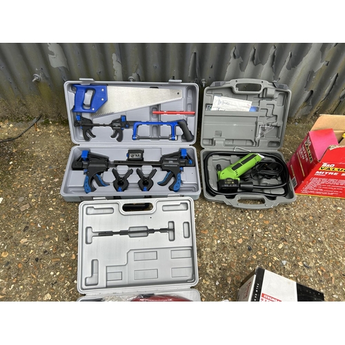 59 - Three cased tool sets, palm sander and mitre saw