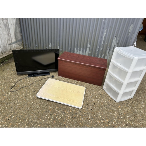 66 - Sony tv, ottoman, folding table and plastic drawers