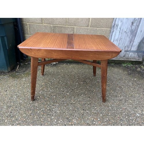 68 - A mid century teak dining table with roller style extension mechanism 107x77x77