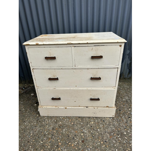 70d - A white painted pine chest of four drawers