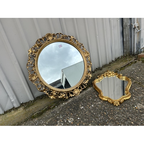 8 - An ornate circular gilt framed mirror together with a other gold framed mirror
