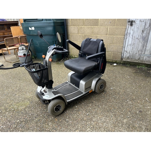 82 - A large mobility scooter with key and charger (requires replacement batteries) with V5