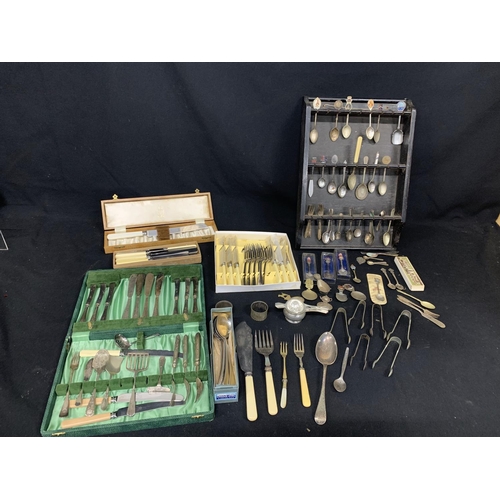 516 - Assorted cutlery and assorted souvenir spoons