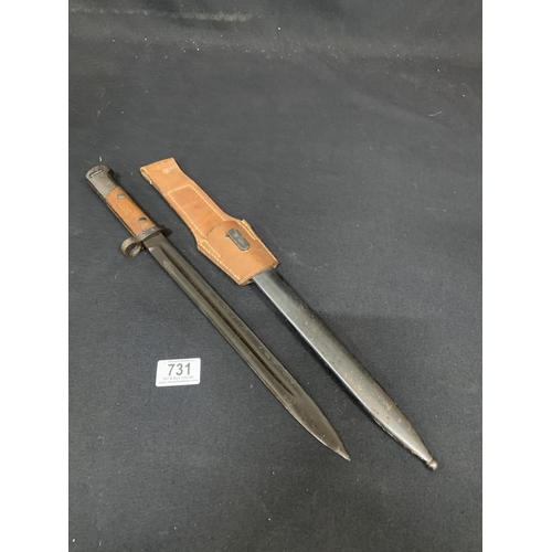 731 - Bayonet in scabbard with leather frog Length 46 cms