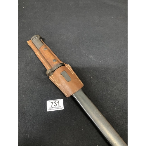 731 - Bayonet in scabbard with leather frog Length 46 cms
