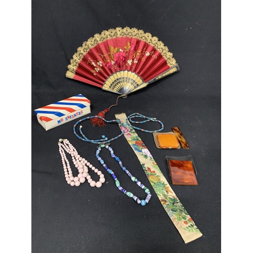 810 - Silk fan, beadwork sleeve and two glass necklaces and two compacts