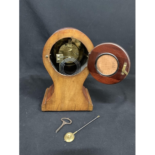 483 - Edwardian mahogany balloon clock with pendulum and key, height 35cms