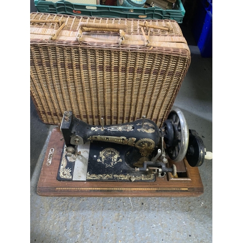 658 - Frister & Rossman vintage sewing machine (no lid) and basket (empty)