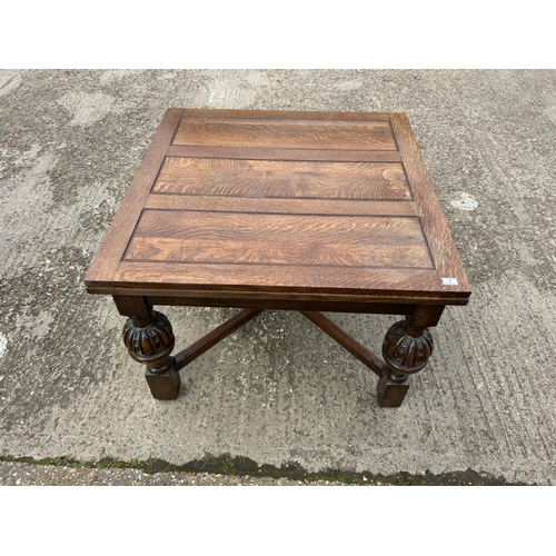 1 - A large oak drawer leaf dining table 106x106x77