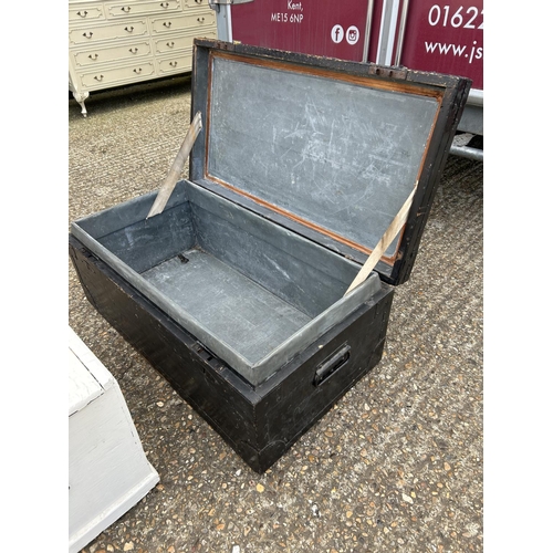 127 - A large black painted locking zinc lined trunk with key together with a white painted box  92x 50x40