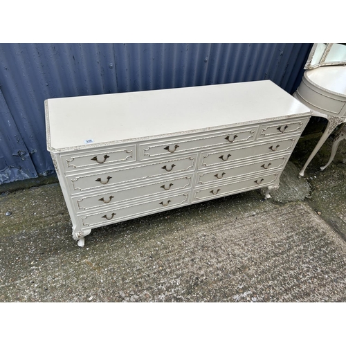 129 - A french style white and gold gilt chest of nine drawers 143x44x77