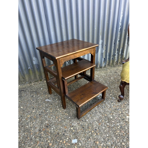 136 - A Victorian yellow upholstered chair together with  a occasional table with retracting library step