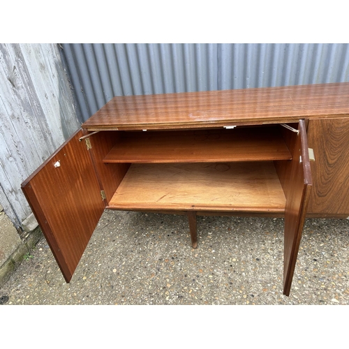 140 - A mid century teak cocktail sideboard by Wrighton 230x 45 x 75