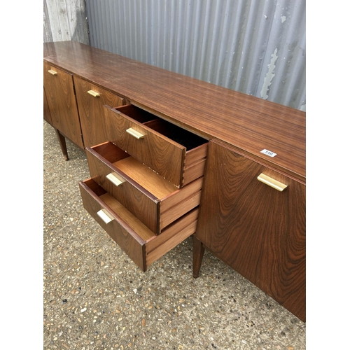 140 - A mid century teak cocktail sideboard by Wrighton 230x 45 x 75