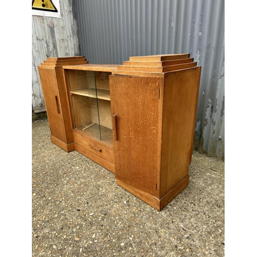 141 - A deco style light oak bookcase sideboard with keys 154x40x90