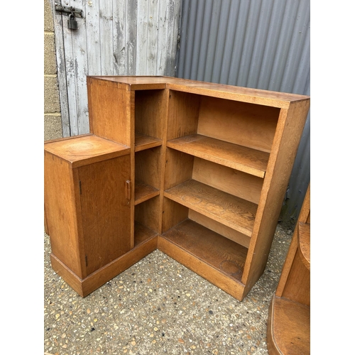 142 - Two deco style light oak corner bookcases