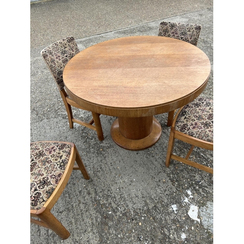 143 - A deco style light oak circular dining table with four chairs 107cm diameter  x 75 high