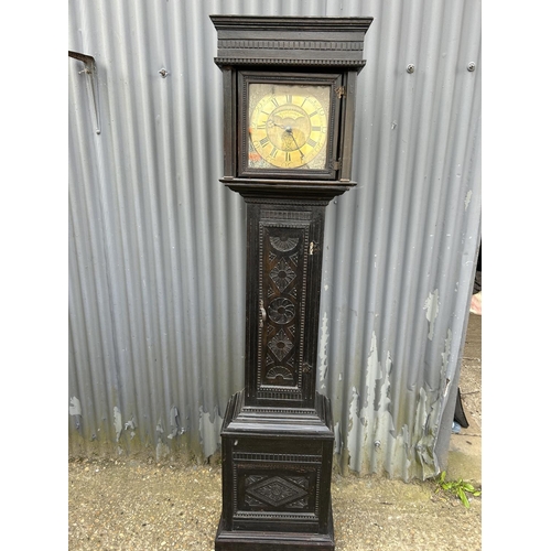 145 - A carved oak longcase clock made by Adam Costen - kirkwood with one weight and pendulum