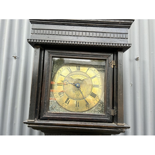 145 - A carved oak longcase clock made by Adam Costen - kirkwood with one weight and pendulum