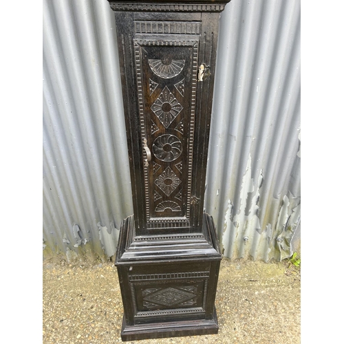 145 - A carved oak longcase clock made by Adam Costen - kirkwood with one weight and pendulum