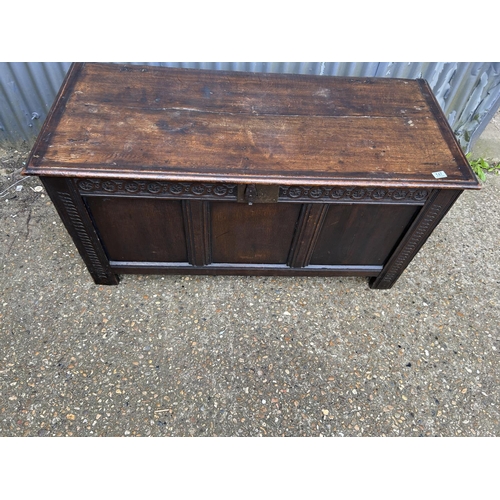 147 - A large carved oak three panel blanket box coffer 136x58x66