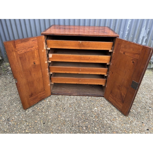 148 - An Edwardian mahogany two door artists cabinet with four slides 72x50 x27