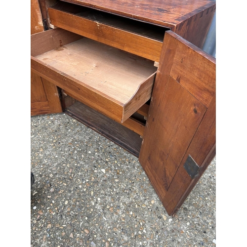 148 - An Edwardian mahogany two door artists cabinet with four slides 72x50 x27