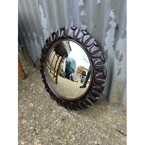 155 - A brass tray top table on folding oak barley twist support together with a carved oak convex mirror