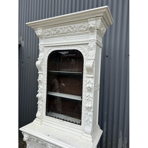 156 - A Dutch style carved oak glazed bookcase over cupboard painted white 90x50x225