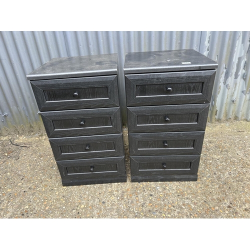 173 - A pair of modern black bedside chests