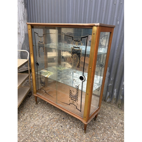 175 - A retro glazed display cabinet together with a aluminium tea trolley