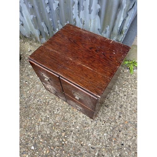 176 - A bank of four oak filing drawers 48x40x40