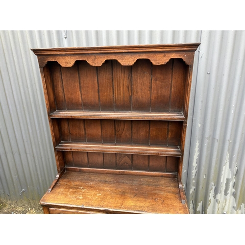 192 - An oak cottage dresser with plate rack top over five drawer base 91x36x164