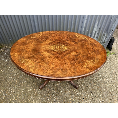 197 - A Victorian inlaid walnut oval loo table  134x100