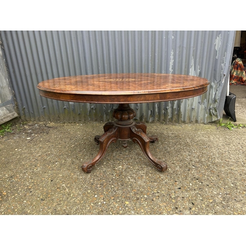 197 - A Victorian inlaid walnut oval loo table  134x100